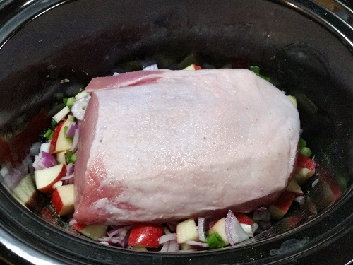 put pork roast fat side up in slow cooker